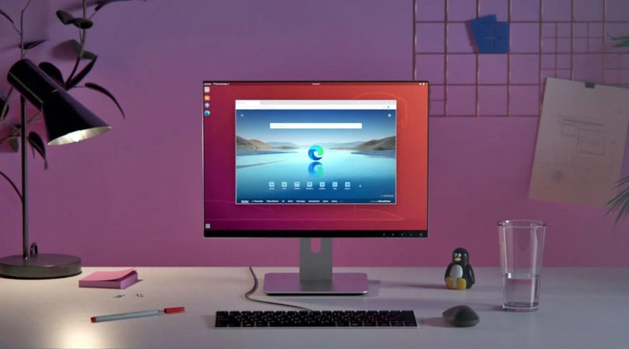Monitor exibe desktop do Ubuntu com janela do Microsoft Edge aberta no centro da tela