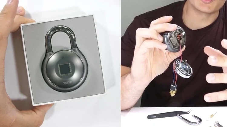 Zack Nelson segura um cadeado aberto ao mesmo. As duas metades esão unidas por um fio